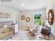 Bright Bedroom with crib, comfortable rocking chair, and natural light from the window at 1611 Spring Lot Dr, Edgemoor, SC 29712