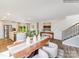 Dining area featuring a large table, modern seating, and seamless flow into the kitchen and living spaces at 1611 Spring Lot Dr, Edgemoor, SC 29712