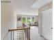 Second floor hallway, leading to the living area, is flooded with natural light from the windows at 1611 Spring Lot Dr, Edgemoor, SC 29712