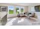 Sun-drenched living room with neutral tones and large windows offering views of the outdoors at 1611 Spring Lot Dr, Edgemoor, SC 29712