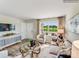Bright and airy living room with large windows, neutral tones, and a welcoming atmosphere at 1611 Spring Lot Dr, Edgemoor, SC 29712