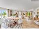 Bright open living space with a dining area, kitchen, and large windows that provide ample natural light at 1611 Spring Lot Dr, Edgemoor, SC 29712