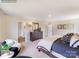 Bright main bedroom features carpet, a large dresser with mirror, and door to ensuite bathroom at 1611 Spring Lot Dr, Edgemoor, SC 29712