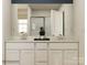 Bathroom with double sinks, modern fixtures, and a glass-enclosed shower at 1621 Spring Lot Dr, Edgemoor, SC 29712