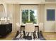 Formal dining area with a modern table, six chairs, neutral tones, and sliding glass door views at 1621 Spring Lot Dr, Edgemoor, SC 29712