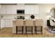 Stylish kitchen with a center island, bar stool seating, stainless steel appliances, and modern white cabinetry at 1621 Spring Lot Dr, Edgemoor, SC 29712