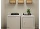 Laundry room with a modern washer and dryer set, and shelving for storage at 1621 Spring Lot Dr, Edgemoor, SC 29712