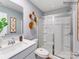 Modern bathroom featuring a glass-enclosed shower, updated fixtures, and light blue walls at 1623 Spring Lot Dr, Edgemoor, SC 29712