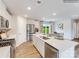 Bright kitchen features stainless appliances, white cabinets and large island at 1623 Spring Lot Dr, Edgemoor, SC 29712