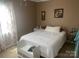 Cozy bedroom with a comfortable bed, neutral decor, and large windows for natural light at 1658 Hillcrest Ave, Lancaster, SC 29720