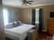 Comfortable bedroom with a large bed, hardwood floors, and plenty of natural light at 1658 Hillcrest Ave, Lancaster, SC 29720