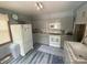 Well-lit kitchen features gray cabinets, marble-look countertops and stainless steel appliances at 1658 Hillcrest Ave, Lancaster, SC 29720
