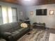 Cozy living room featuring a comfortable sofa, rug and large-screen television for entertainment at 1658 Hillcrest Ave, Lancaster, SC 29720