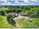A scenic aerial view of a country estate, complete with mature trees, manicured lawns and outbuildings at 1723 Baskins Hill Rd, Heath Springs, SC 29058