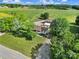 A landscape aerial view of a countryside property featuring a well-kept lawn, mature trees, and several buildings at 1723 Baskins Hill Rd, Heath Springs, SC 29058
