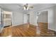 Bedroom with hardwood floors and a view of the bathroom through the doorway at 1723 Baskins Hill Rd, Heath Springs, SC 29058