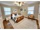 Charming bedroom with hardwood floors, wooden furniture and lots of artwork at 1723 Baskins Hill Rd, Heath Springs, SC 29058