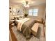 Well-decorated bedroom with neutral walls, hardwood floors, and a ceiling fan at 1723 Baskins Hill Rd, Heath Springs, SC 29058