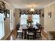 Formal dining room features hardwood floors, neutral paint, chandelier and a large window view at 1723 Baskins Hill Rd, Heath Springs, SC 29058