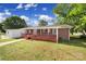 Charming brick home with a spacious front porch and lush green lawn at 1723 Baskins Hill Rd, Heath Springs, SC 29058