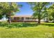 Charming brick home with a well-maintained lawn and inviting front porch at 1723 Baskins Hill Rd, Heath Springs, SC 29058