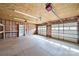 Garage interior featuring a garage door, storage shelves, and ample workspace at 1723 Baskins Hill Rd, Heath Springs, SC 29058