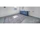 Large Laundry Room with storage, blue cabinets, and tile floors at 1723 Baskins Hill Rd, Heath Springs, SC 29058
