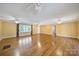 Bright living room featuring gleaming hardwood floors and a ceiling fan at 1723 Baskins Hill Rd, Heath Springs, SC 29058