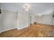 Living Room shows hardwood floors, neutral paint, decorative lighting and side access to the yard at 1723 Baskins Hill Rd, Heath Springs, SC 29058