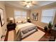 Cozy main bedroom with modern decor, hardwood floors, and lots of natural light at 1723 Baskins Hill Rd, Heath Springs, SC 29058