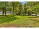 Expansive backyard with mature trees, shed, and lush green grass at 1760 Jacobs Way, Sherrills Ford, NC 28673