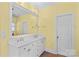 Bright bathroom featuring a dual-sink vanity and neutral wall color at 1760 Jacobs Way, Sherrills Ford, NC 28673