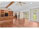 Sunlit living room boasting hardwood floors, custom built-ins, and easy access to the kitchen at 1760 Jacobs Way, Sherrills Ford, NC 28673