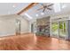 Spacious living area featuring a stone fireplace, hardwood floors, and access to the outdoors at 1760 Jacobs Way, Sherrills Ford, NC 28673