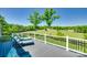 Relaxing back deck with lounge chairs overlooking a serene grassy field and distant buildings at 1780 Sierra Rd, York, SC 29745