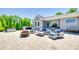 Relaxing backyard patio with an outdoor kitchen, stylish seating, and a fire pit at 1780 Sierra Rd, York, SC 29745