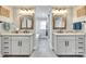 Well lit dual vanity bathroom showcasing granite counters, tile floors, and a walk in shower at 1780 Sierra Rd, York, SC 29745