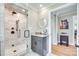 Modern bathroom featuring a walk-in shower with bronze fixtures, marble tile, and granite countertop at 1780 Sierra Rd, York, SC 29745
