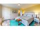 Bright bedroom with a queen-sized bed, teal accents, and a connecting bathroom for added convenience at 1780 Sierra Rd, York, SC 29745