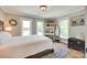 Bright bedroom featuring multiple windows, wood floors, a decorative rug, and stylish furniture at 1780 Sierra Rd, York, SC 29745