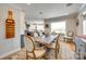 Charming dining room with a rustic table, upholstered chairs, hardwood floors, and natural light at 1780 Sierra Rd, York, SC 29745