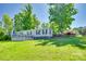 Well-maintained mobile home with a large deck and established landscaping, set on a lush green lawn at 1780 Sierra Rd, York, SC 29745