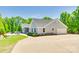 Charming home with gray siding, well-maintained landscaping, and an attached garage at 1780 Sierra Rd, York, SC 29745