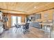 Charming kitchen with rustic wood walls, modern appliances, and a table for dining within a cozy design at 1780 Sierra Rd, York, SC 29745