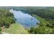 Aerial view of the lake surrounded by lush trees with a dock in a secluded location at 1780 Sierra Rd, York, SC 29745