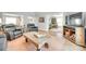Cozy living room featuring leather chairs, wood accents, and an open floor plan with hardwood floors at 1780 Sierra Rd, York, SC 29745