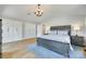 Spacious main bedroom featuring a vaulted ceiling, wood floors, a large bed, and multiple closets at 1780 Sierra Rd, York, SC 29745