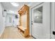 Mudroom featuring a wooden bench with storage, with laundry equipment against white painted walls and a door to a garage at 1780 Sierra Rd, York, SC 29745