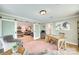 Office with wood floors and natural light, featuring an open doorway to a comfortable living room at 1780 Sierra Rd, York, SC 29745