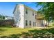 Back exterior features walk out basement, second story wooden deck, and large fenced in backyard at 1806 Red Bird Cir, Concord, NC 28025